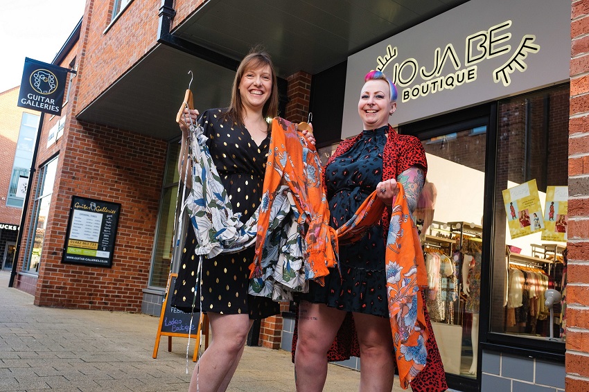 Owner Jo Briggs and boutique manager Sarah Rhodes hold summer dresses outside Jo Ja Be Boutique at Flemingate in Beverley